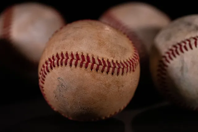 Close-up of well-worn leather baseballs