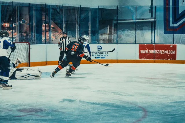 Ice hockey players competing during a match on the rink