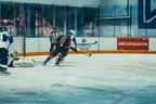 Ice hockey players competing during a match on the rink