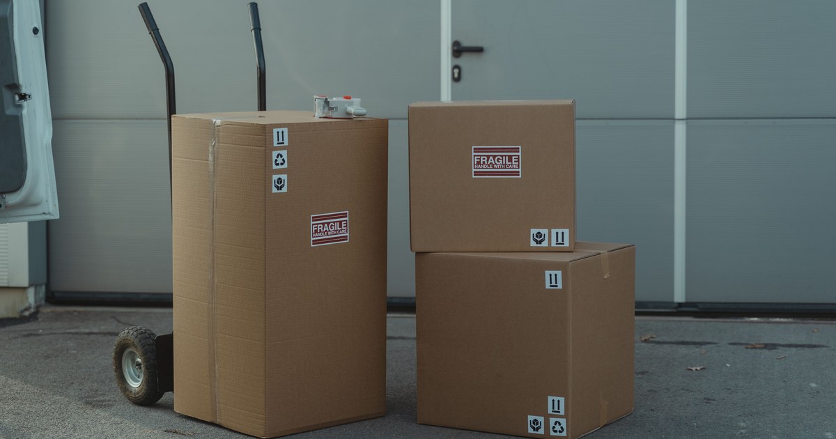 Cardboard boxes marked fragile, stacked and ready for shipping